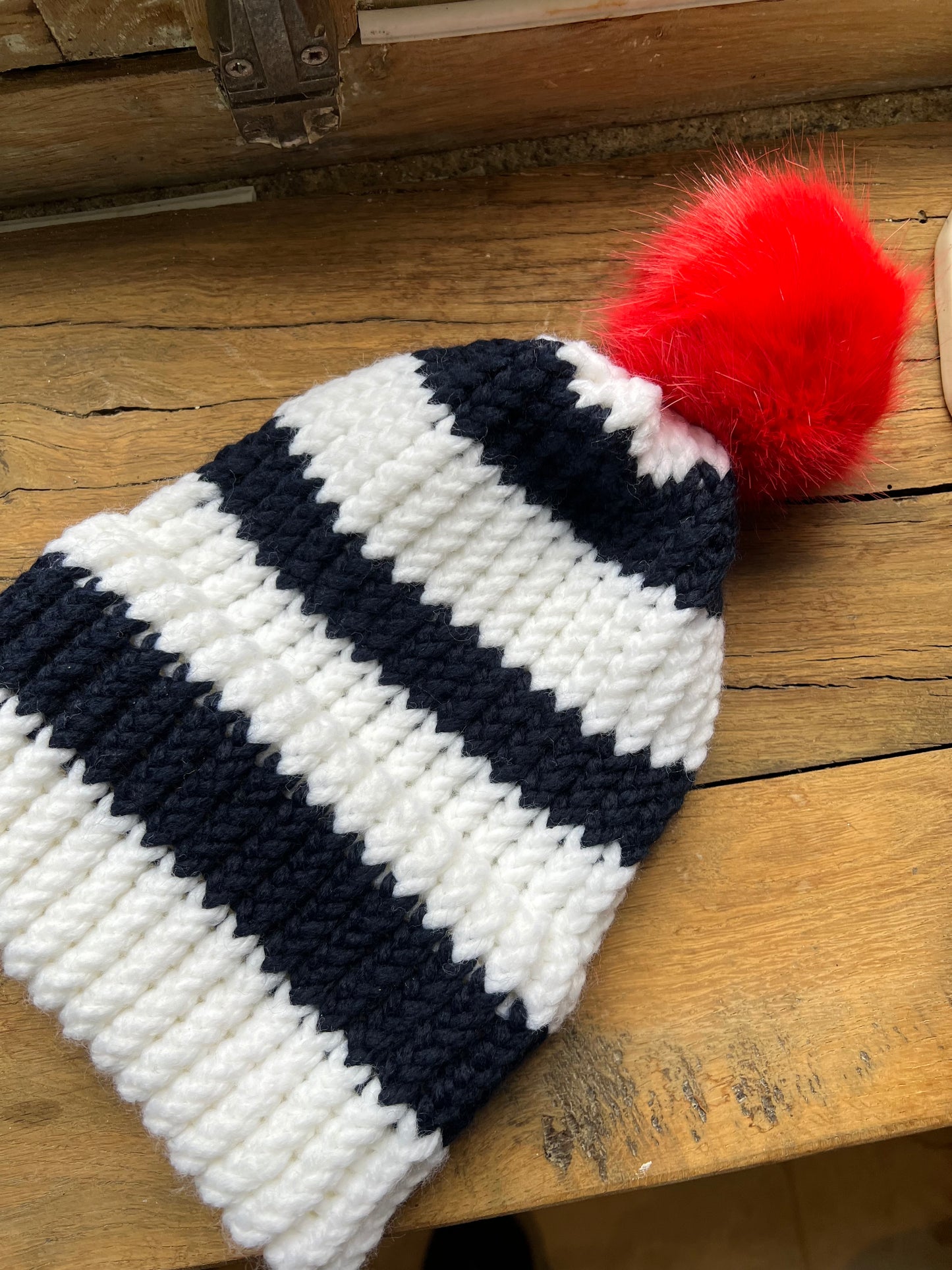 Hand knit orange pom-pom hat 🧡